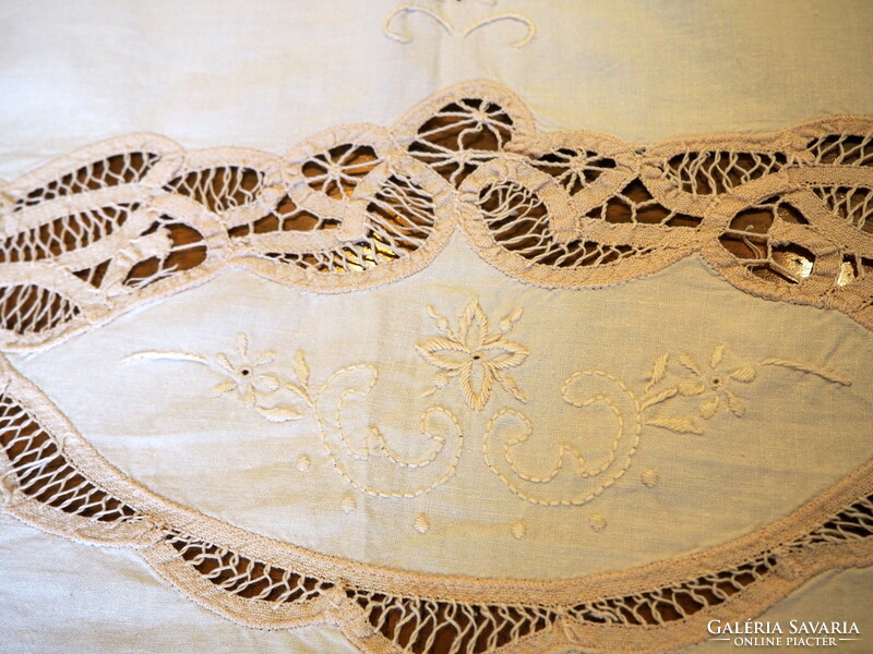 Beautiful embroidered tablecloth decorated with ribbon crochet