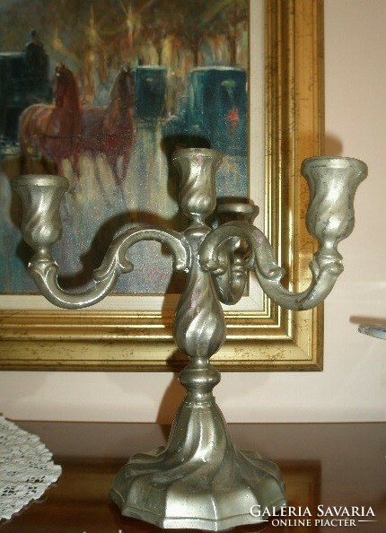 Old heavy metal four-arm candle holder - art&decoration