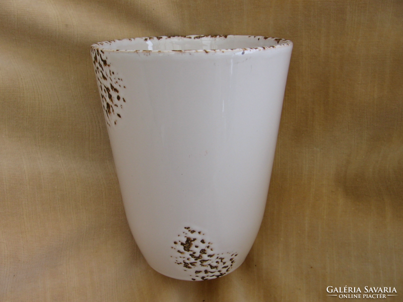 White flowerpot, vase with some brown
