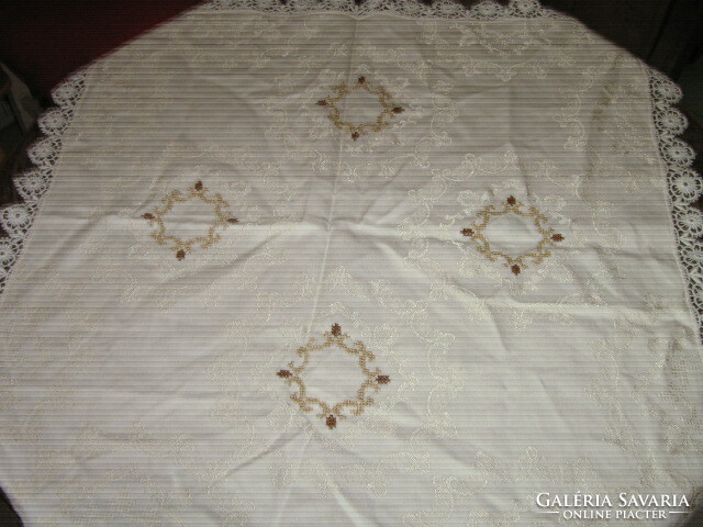 Beautiful embroidered damask tablecloth with a lace edge