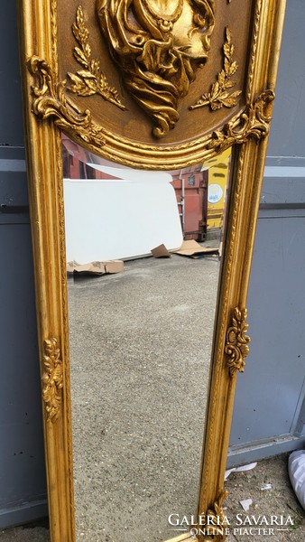 Gilded mirror in the shape of a woman