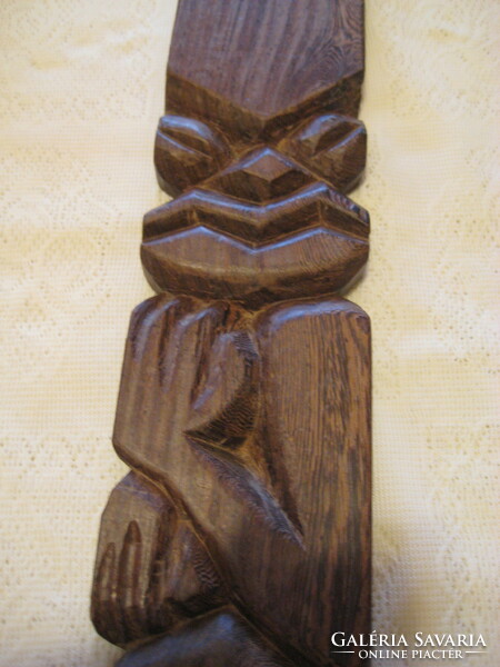 Carved African wall decoration with ematule inscription, 10 x 45 x 2 cm
