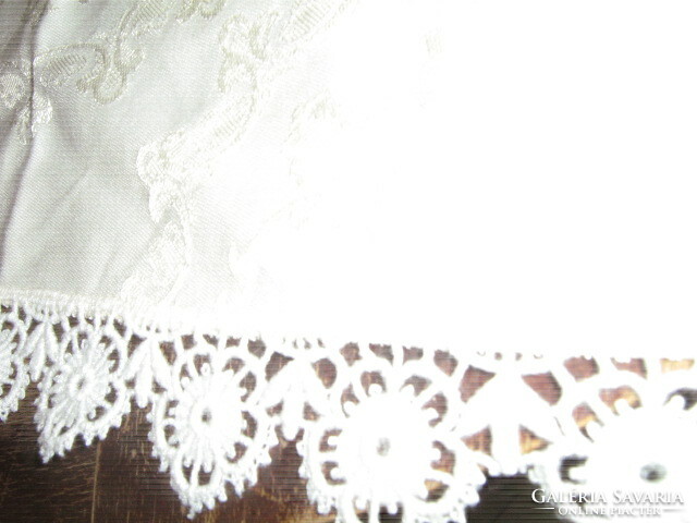 Beautiful embroidered damask tablecloth with a lace edge