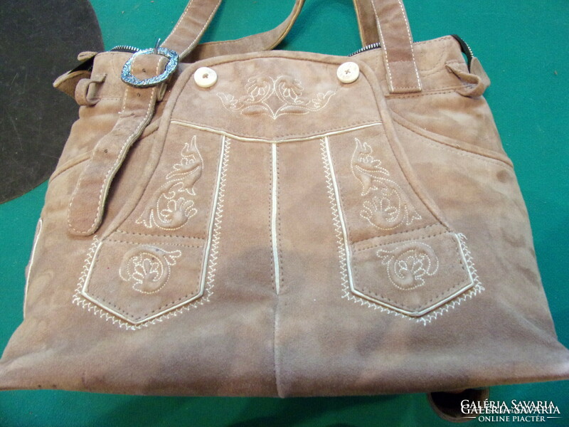 Leather bag with a delicate velvety feel to denim pants