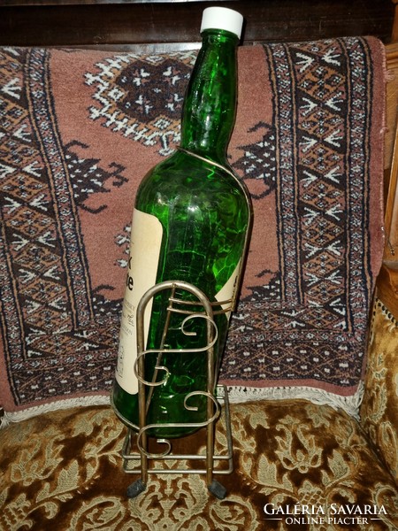 Old cognac bottle with holder