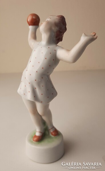 Retro porcelain statue, figure of a little girl playing a ball