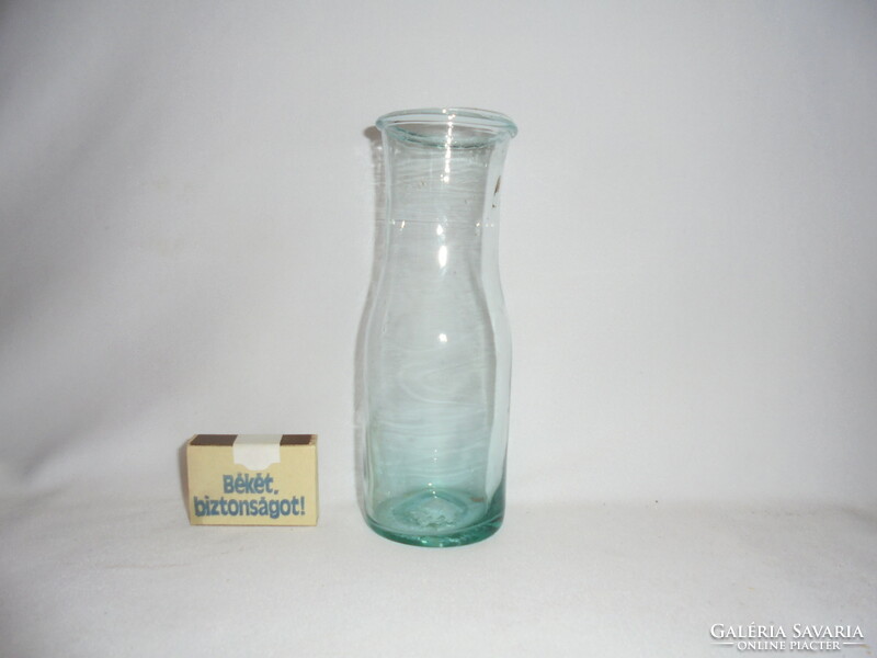 Antique turquoise glass bottle with a broken bottom