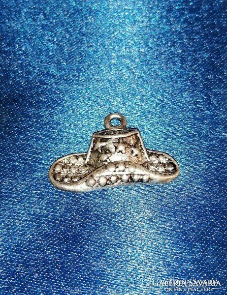 Cowboy hat with metal pendant