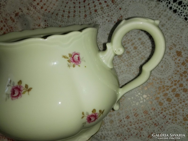 Old, red rose porcelain tea spout.