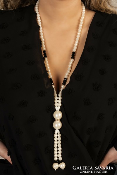 Elegant, long pearl necklaces are beautiful.