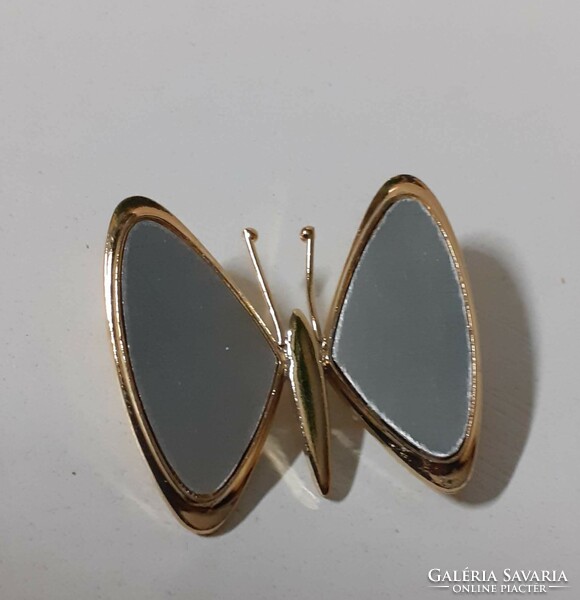 A gold-plated butterfly-shaped brooch in beautiful condition