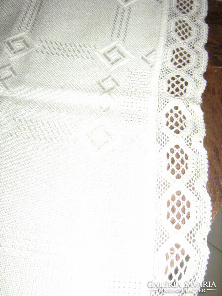 Beautiful, elegant butter-colored hand-embroidered woven tablecloth with a lace edge