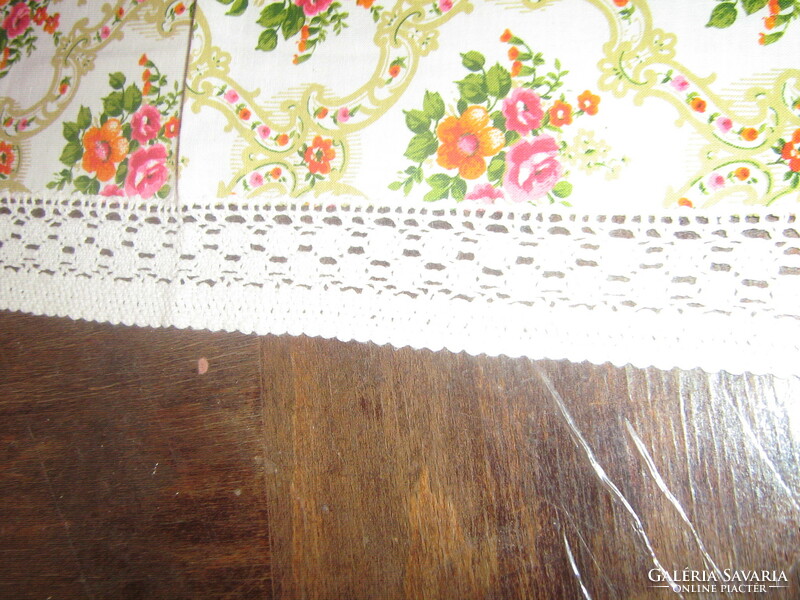 A cute baroque rose pattern tablecloth with a lace edge