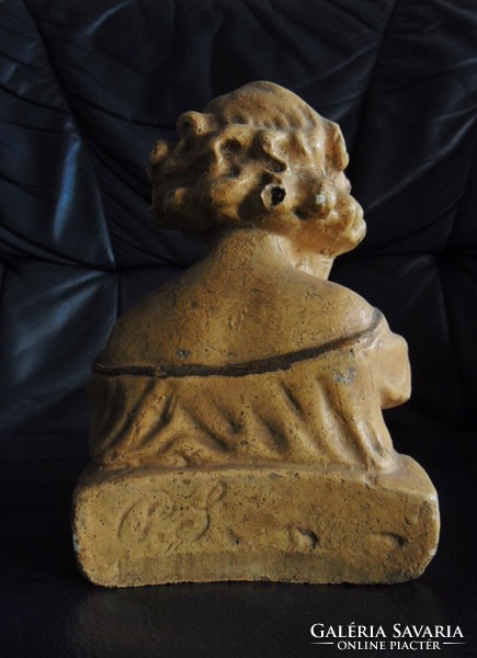 Antique bust of a reading girl