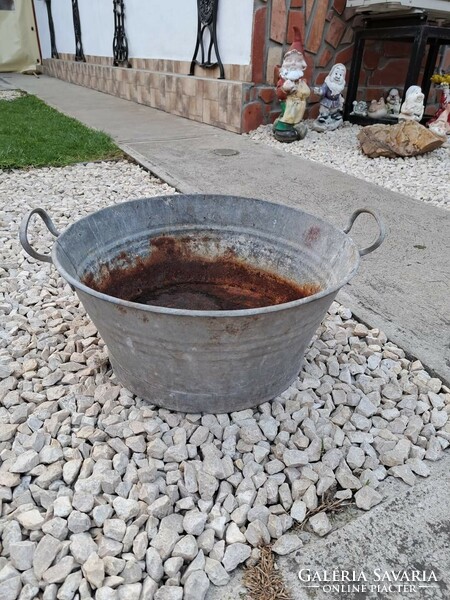 Retro tin pot for planting flowers, a village peasant decoration
