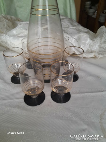 Set of black stemmed glasses with gold trim