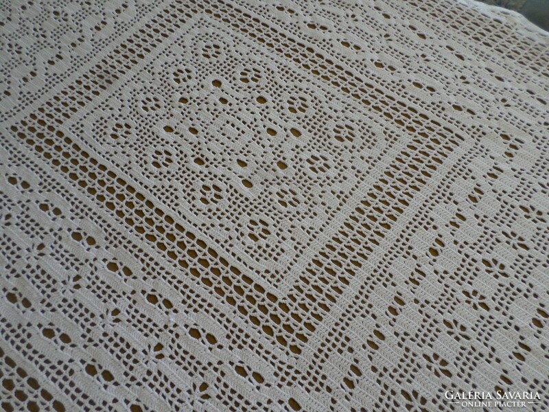 Snow white crocheted lace tablecloth.