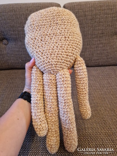 Cream colored knitted octopus baby