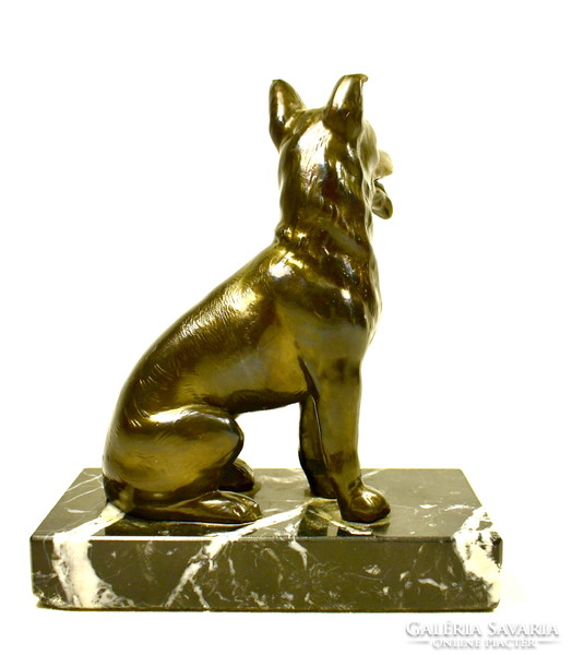 German shepherd - dog statue on a stone plinth