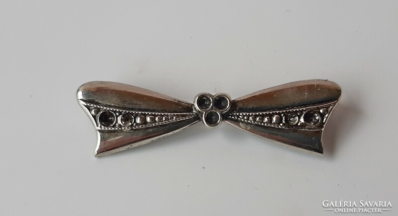 Vintage silver colored bow brooch