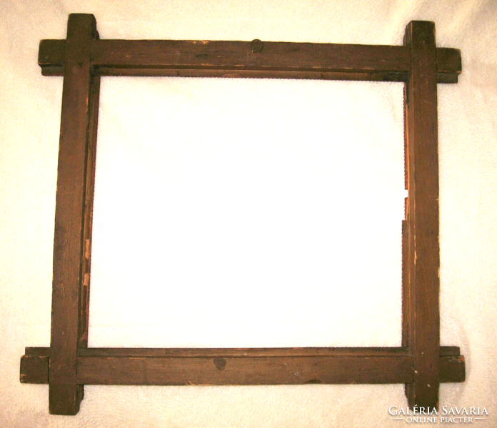 Old tramp art frame with a heart motif on the corner