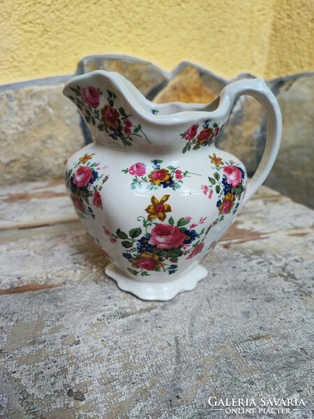 Staffordshire small jug with floral pattern.