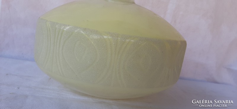 Cream glass bottle with lacy pattern