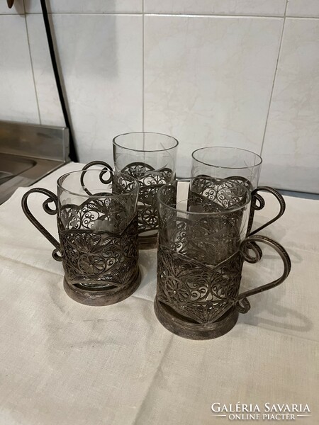 4 cup holders with cut glass glasses