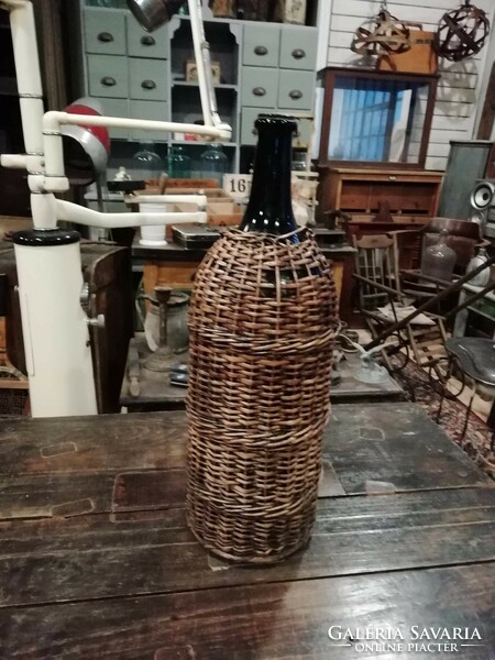 Wicker old glass, perhaps with petroleum in front of it, a wine demizon, large size, for sale as a floor vase