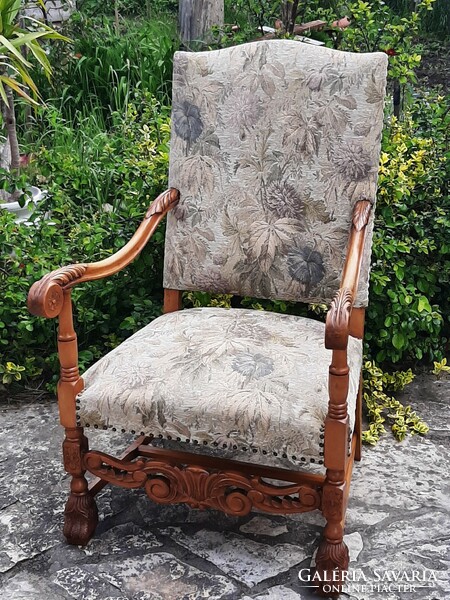 Antique Renaissance throne chair decorated with carvings