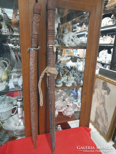 Hand-carved wooden, metal-bladed sword, decorative sword.