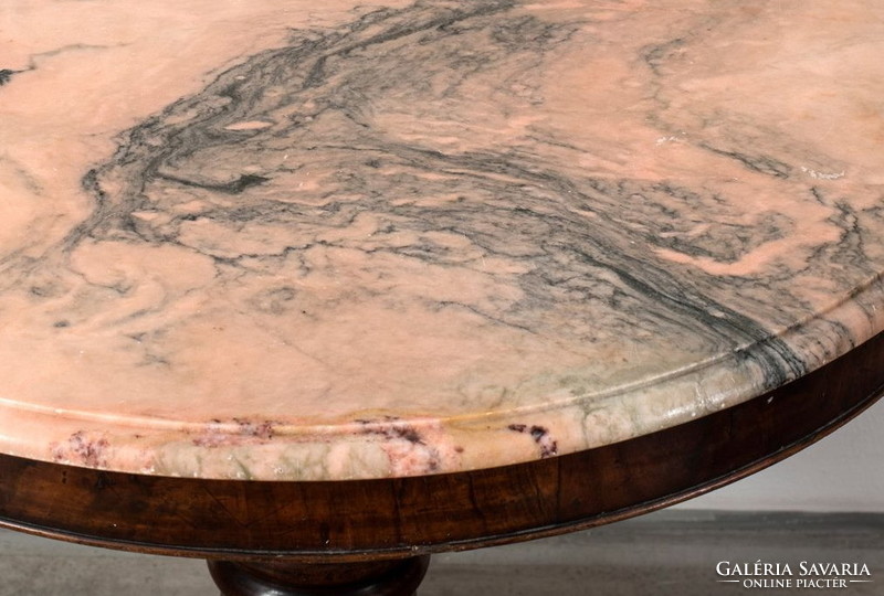 Round table with pink marble top