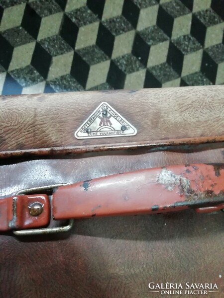 The antique travel suitcase is in the condition shown in the pictures
