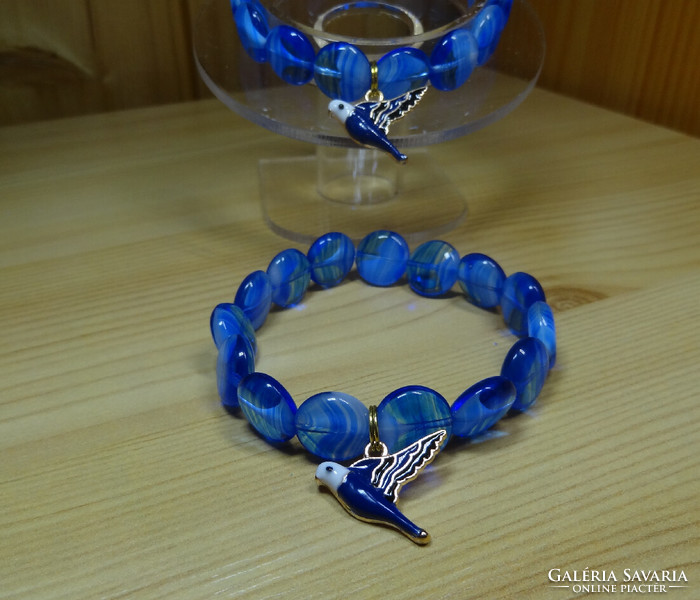 Bracelet made of Czech pearls in the shape of a white lentil flowing into blue, blue bird of happiness, fire enamel.