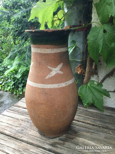 Tiled jug with x decoration
