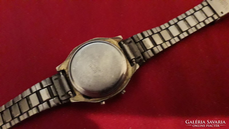 Domi quartz women's wristwatch from an old socialist era with untested steel strap as shown in the pictures