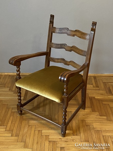 Elegant pewter arm chair in stable room condition, even next to a desk