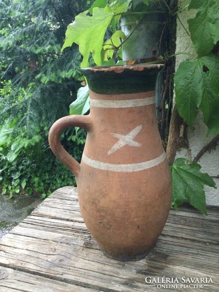 Tiled jug with x decoration