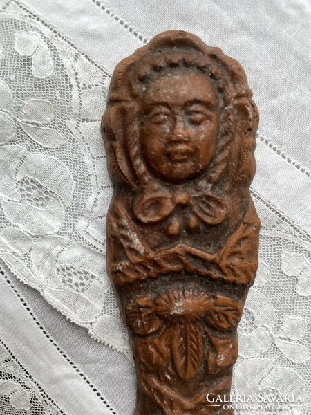 Hanging gingerbread baby in swaddling clothes, ceramic figure decoration