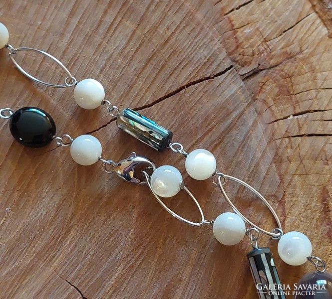 Special long silver necklace with onyx and mother-of-pearl minerals