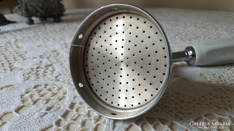 Old shower head with ceramic insert handle