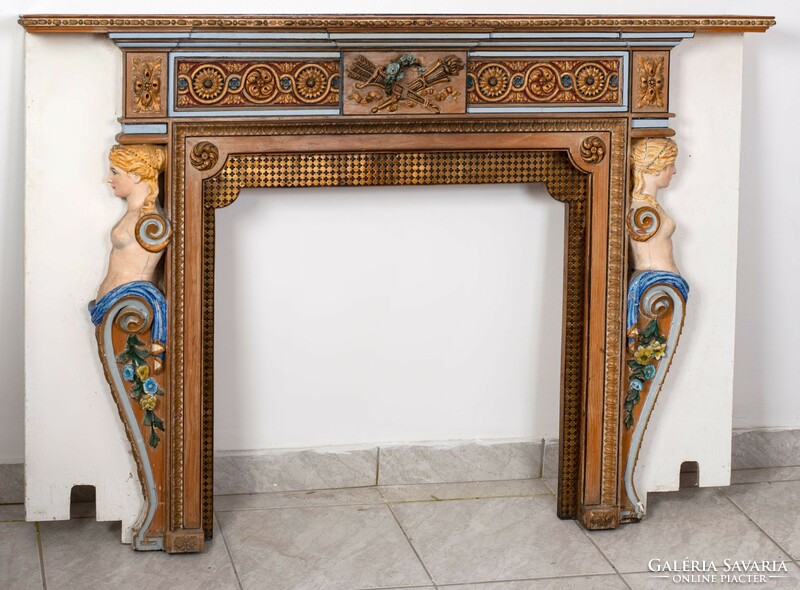 Carved, painted fireplace frame with plastic figures