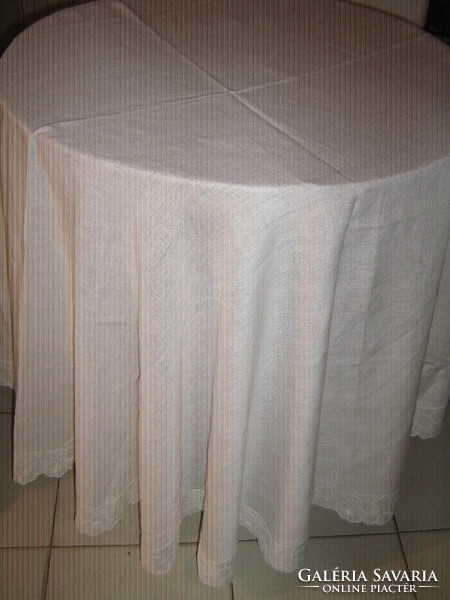 Dreamy antique snow-white elegant round woven tablecloth with floral lace edges