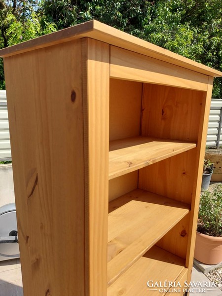 A shelf made of acacia wood with metal handles and hinges is for sale.