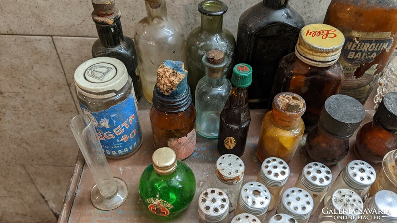 A mix of tiny pharmacy bottles