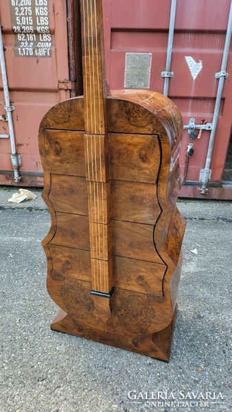 Art deco instrument chest of drawers, in the shape of a cello