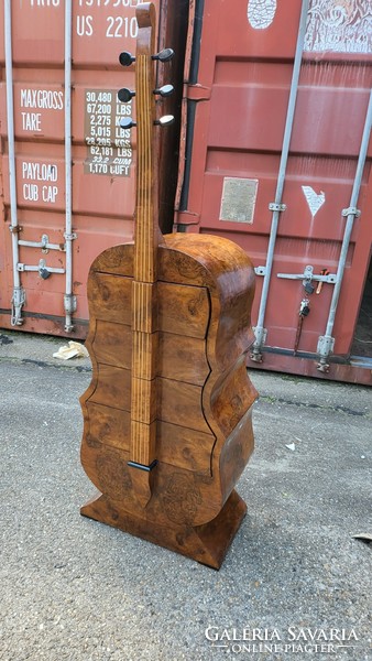 Art deco instrument chest of drawers, in the shape of a cello