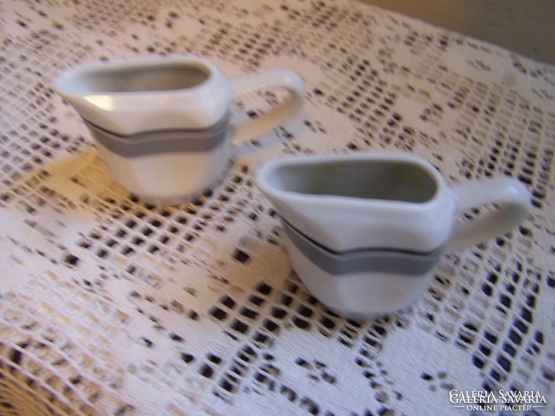 Two pieces of Zsolnay cream pouring jug in one glazed porcelain, marked in good condition