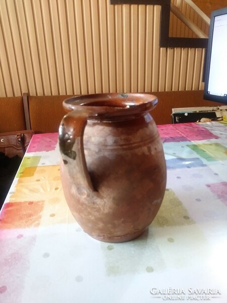 Old folk earthenware pot, jug with a handle