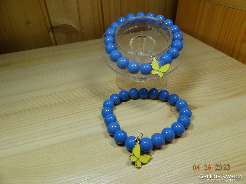 Bracelet made of beautiful blue glass beads with fire enamel butterfly decoration